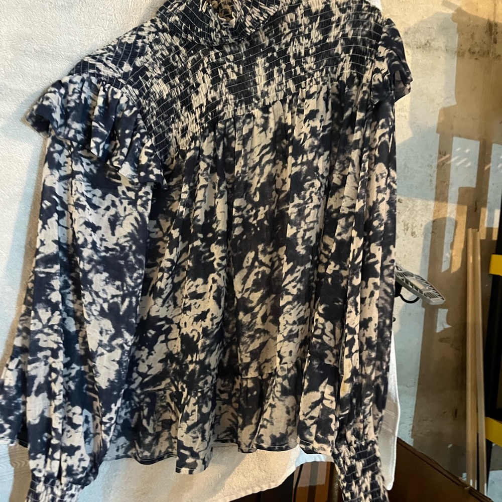 Blue and white print small top with high neck and smocked sleeves